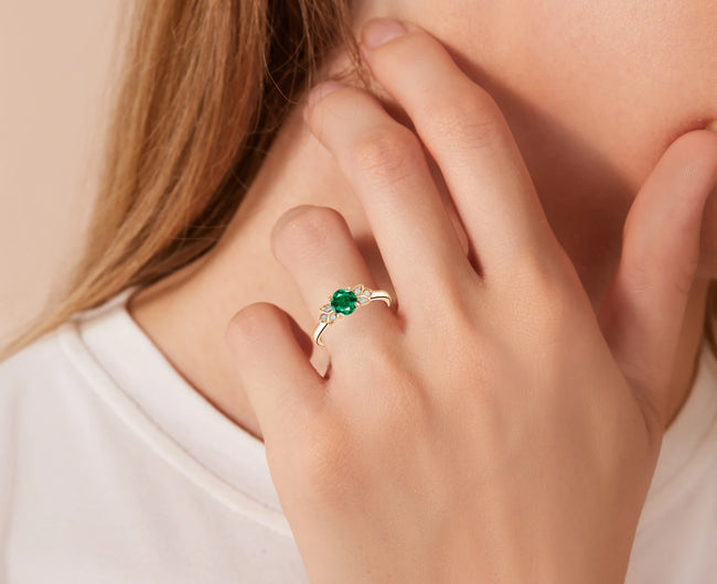 Marganita-emerald-engagement-ring-on-hand